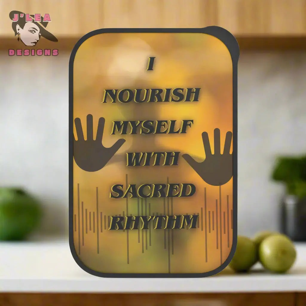 Decorative bento box with text and hand designs on a blurred background