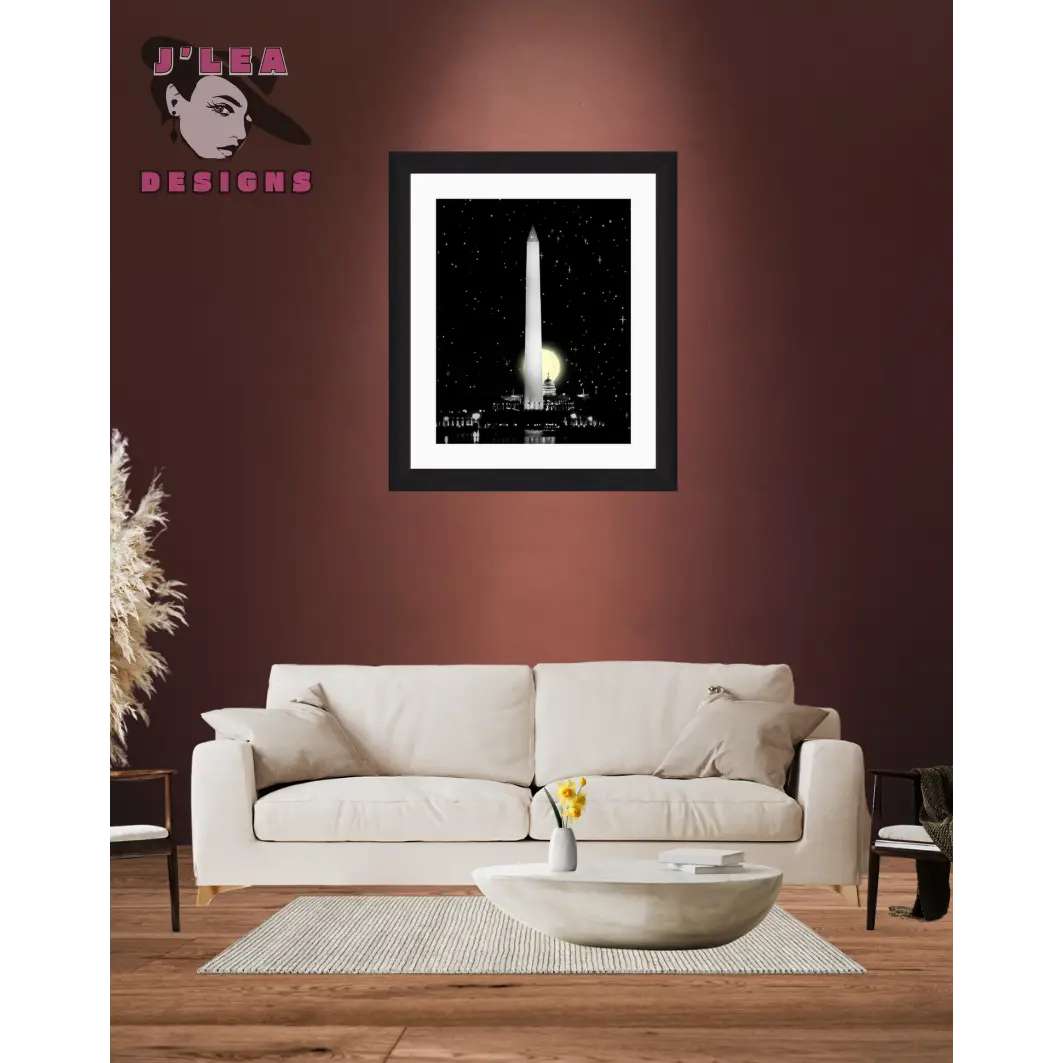 Framed artwork of a cityscape with the Washington Monument on a dark background, displayed above a beige sofa in a living room.