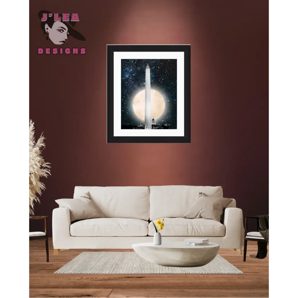 Framed artwork of a moonlit scene with a tall structure, displayed above a beige sofa in a living room.